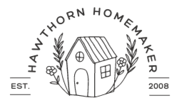 hawtorn homemaker logo a small house with flowers around the sides